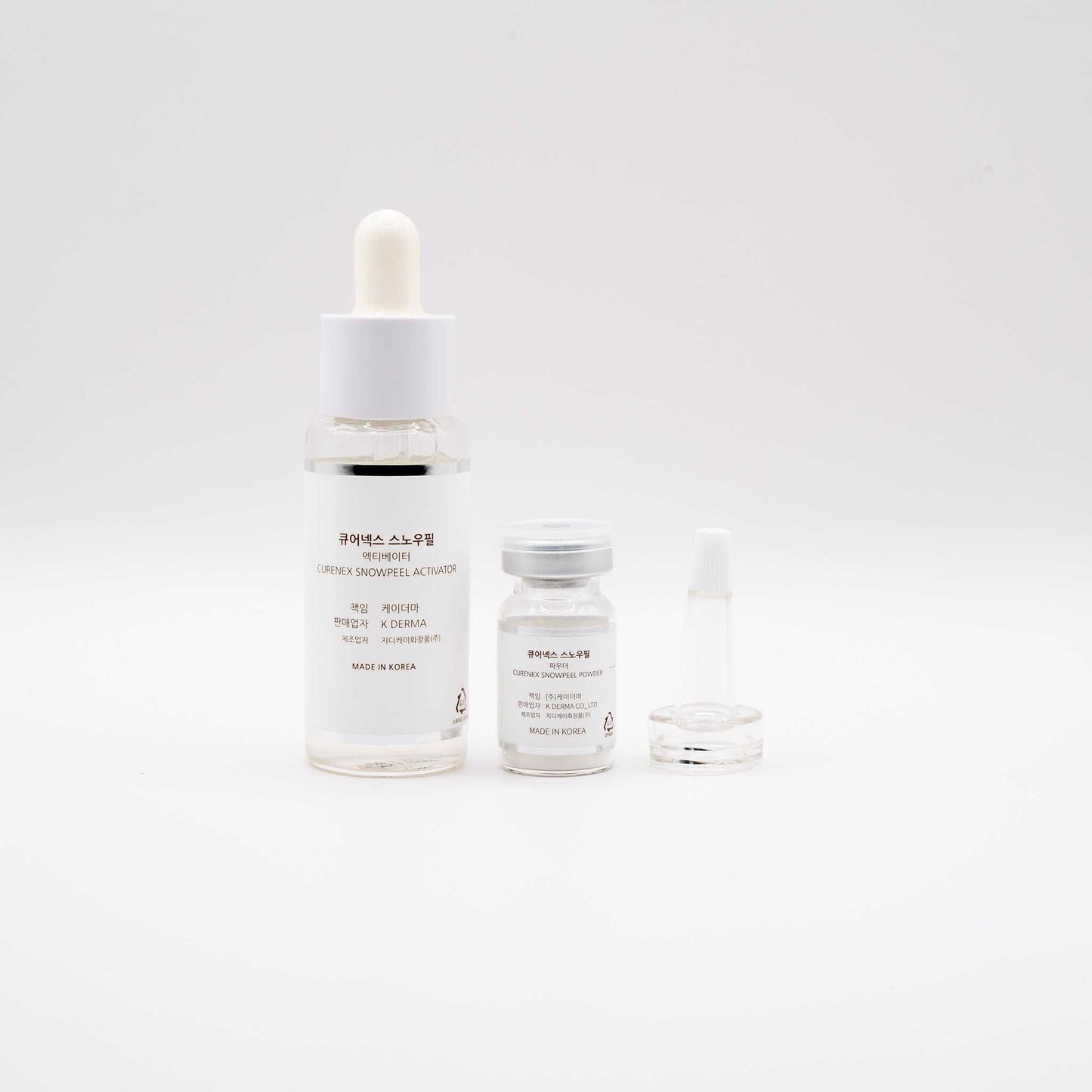 Curenex Snow Peel professional exfoliating treatment kit with Salmon DNA and activator vial on white background